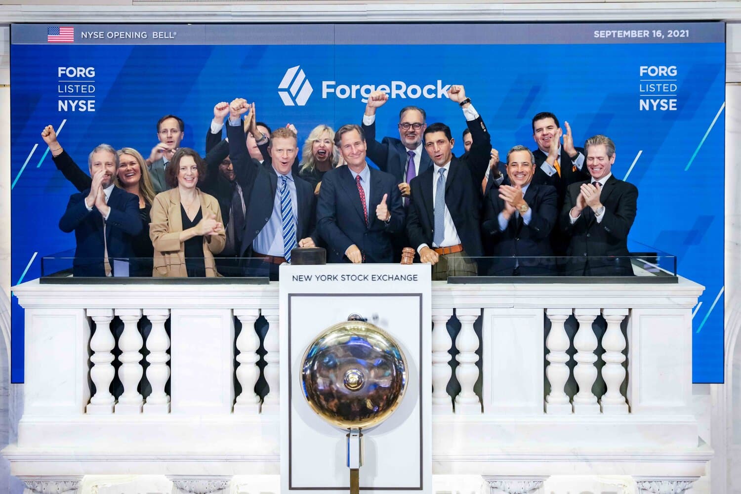 ForgeRock team on a podium celebrating