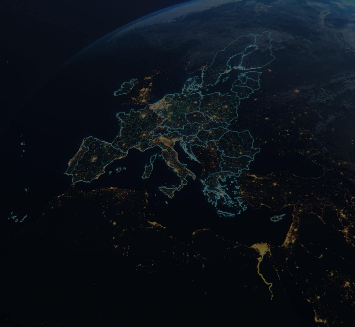 satelite view of europe at night from space with countries outlined in blue