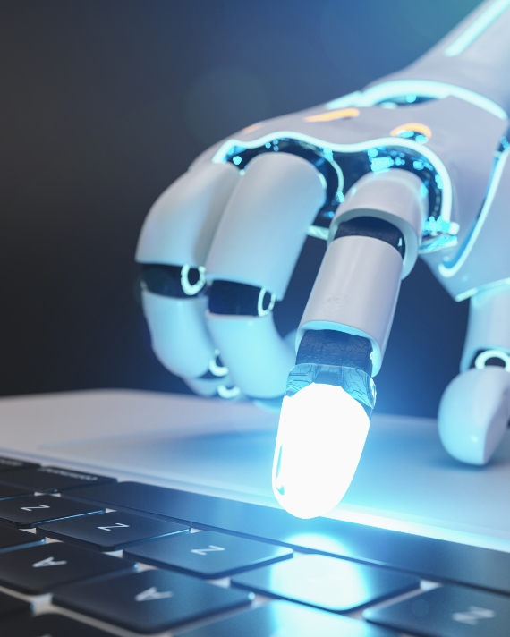 a glowing white robotic hand uses a keyboard